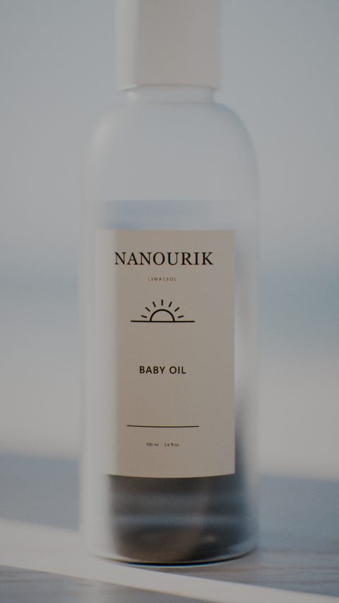 Nanourik baby oil in a frosted bottle